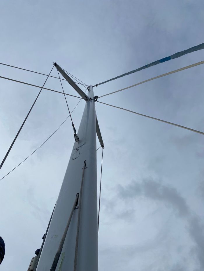 Looking up a catamaran mast with diamond stays and spreaders