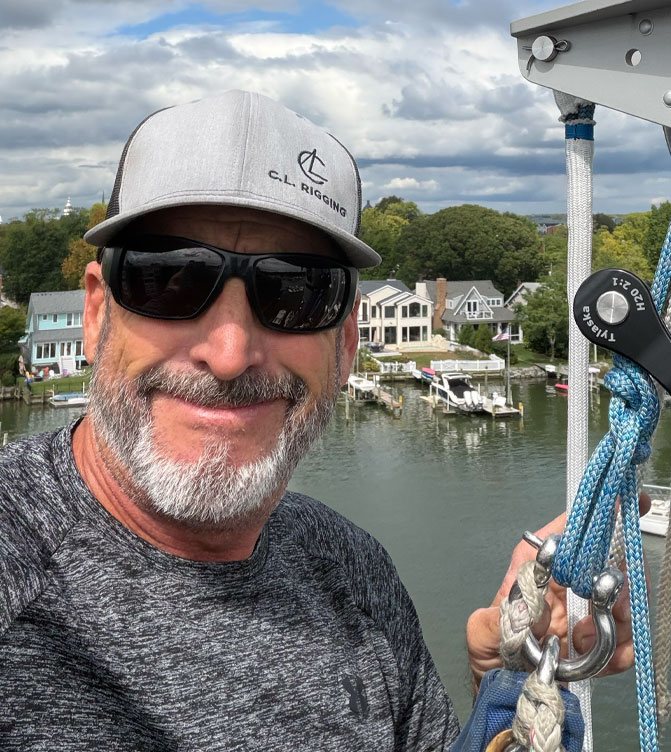 Collin Linehan, owner of C.L. Rigging, aloft above an Annapolis creek