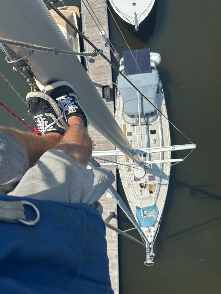 View down the mast from aloft to the deck and dock below