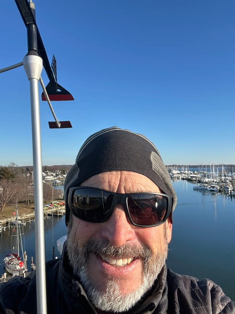 Rigger aloft at the masthead